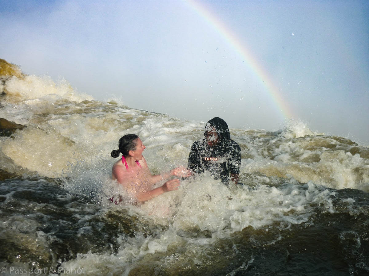 An image having fun in the Angels Pool, Victoria Falls, on Livingstone Island in Zambia.