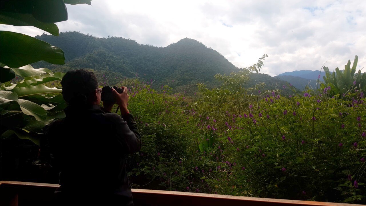 An image of me and a camera catching the view from our terrace at Las Terrazas de Dana Lodge
