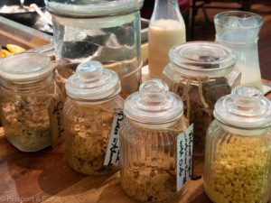 An image of glass jars filled with different cereals at the Mulu Marriott Resort and Spa breakfast