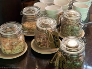An image of jars filled with different toppings for cereals including nuts and seeds served at breakfast at the Marriott Mulu hotel in Sarawak