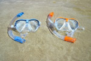 An image of a blue and orange snorkel mask and snorkel