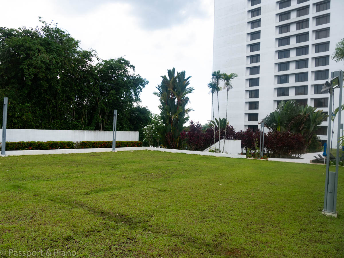 An image of the small grass playing field at the Hilton Kuching hotel, Kuching, Sarawak, Malaysia