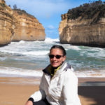 An image of me at Loch Ard Gorge, one of the travel sites, Australia that's along the Great Ocean Road