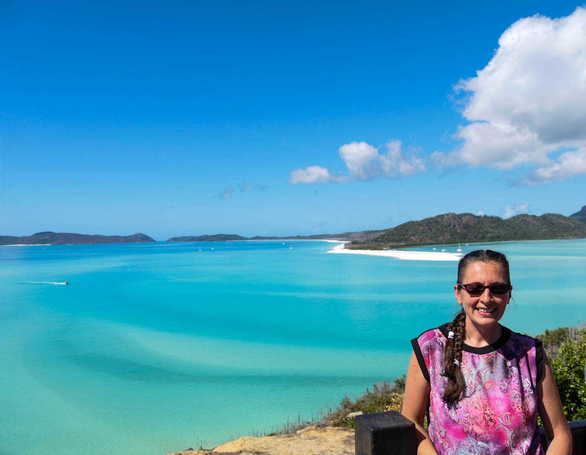 An image of myself at Whitehaven Beach one of places to visit in my Australia travel guide.