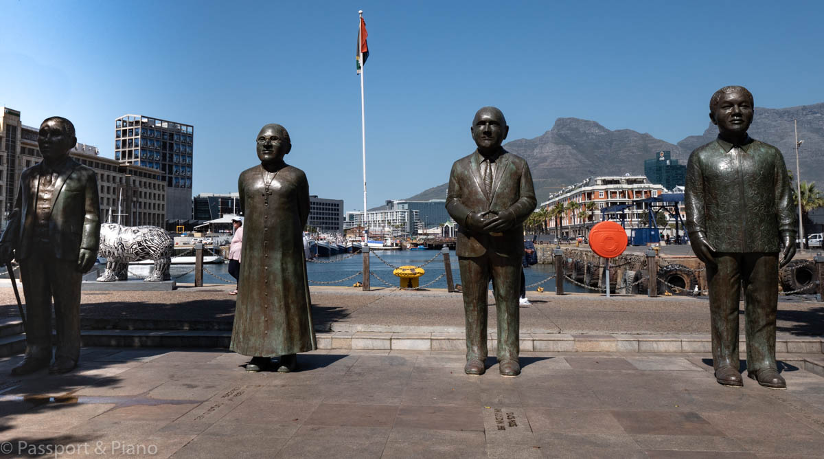 An image of the four bronze statues at Nobel Square, Cape Town Waterfront