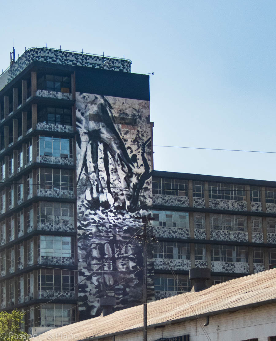 An image of a street mural on the side of a building in Maboneng