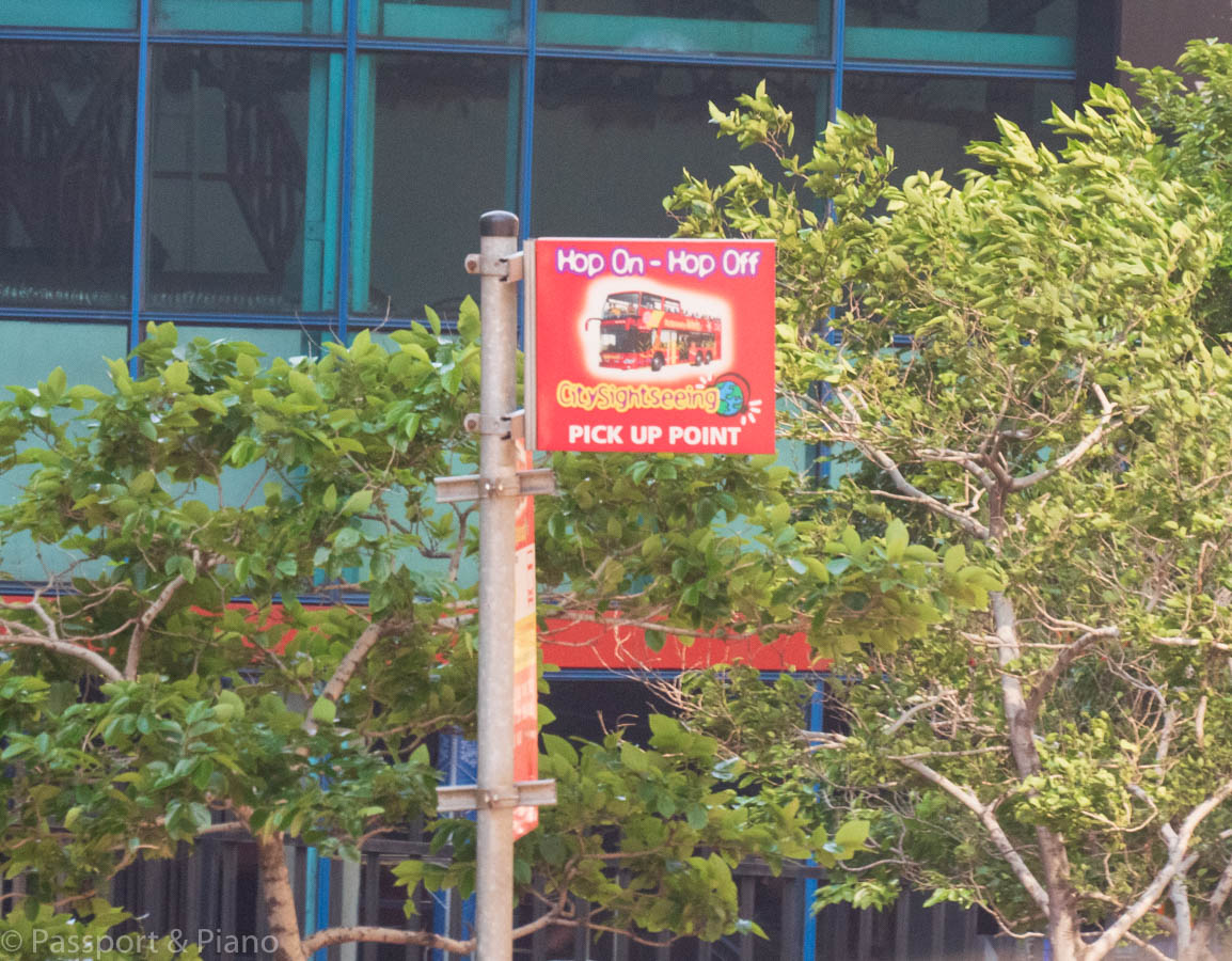 An image of the red hop on hop off Johannesburg city sightseeing bus stop