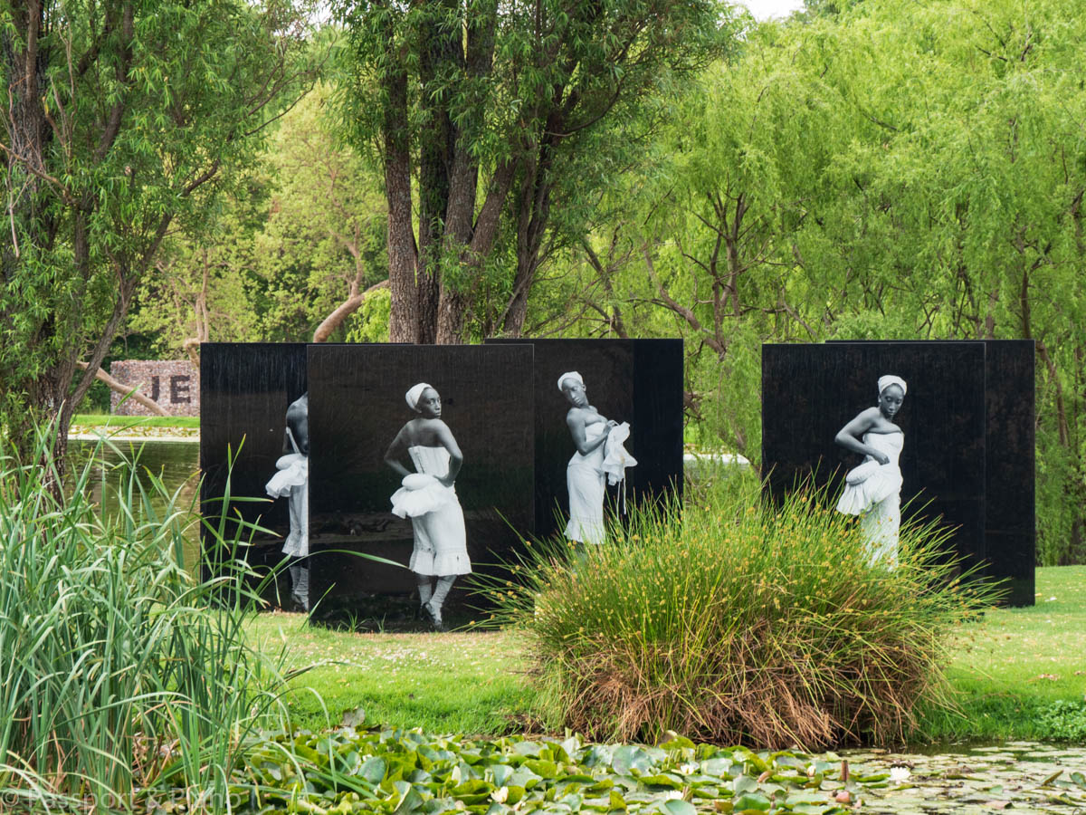 An image of 4 perspex sculptures in black with figures of ladies on them