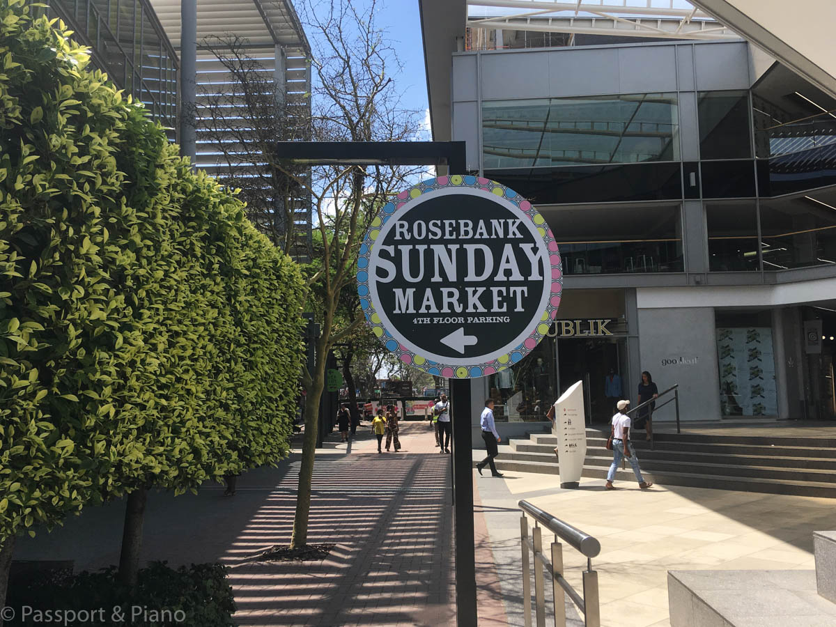 An image of the signpost for Rosebank Sunday Market