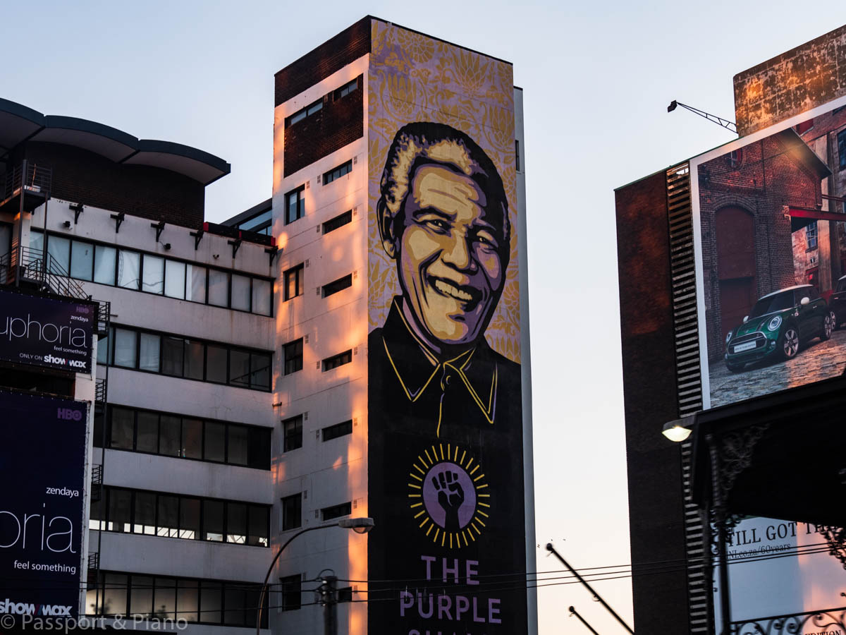 An image of Nelson Mandela painted on the side of a building