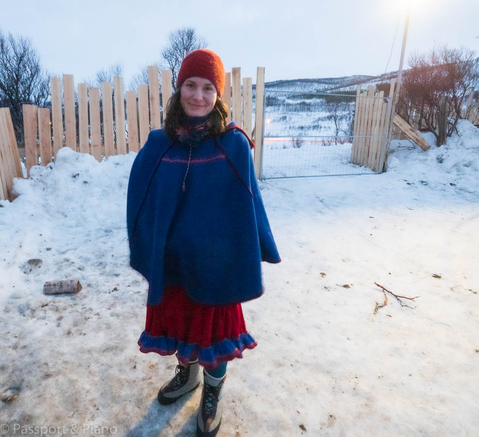 An image of a girl dressed in traditional clothing on Sami tours