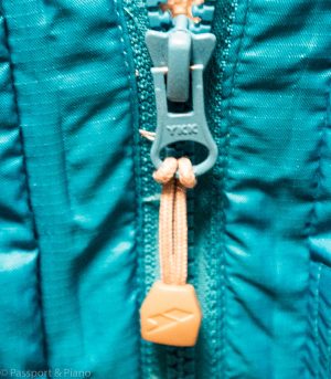 An image of the toggle on a Norway ski jacket that makes it easy to pull the zip while wearing gloves