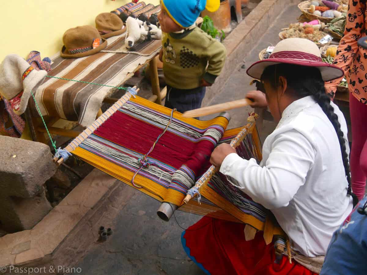 An image of a Peruvian lady weaving