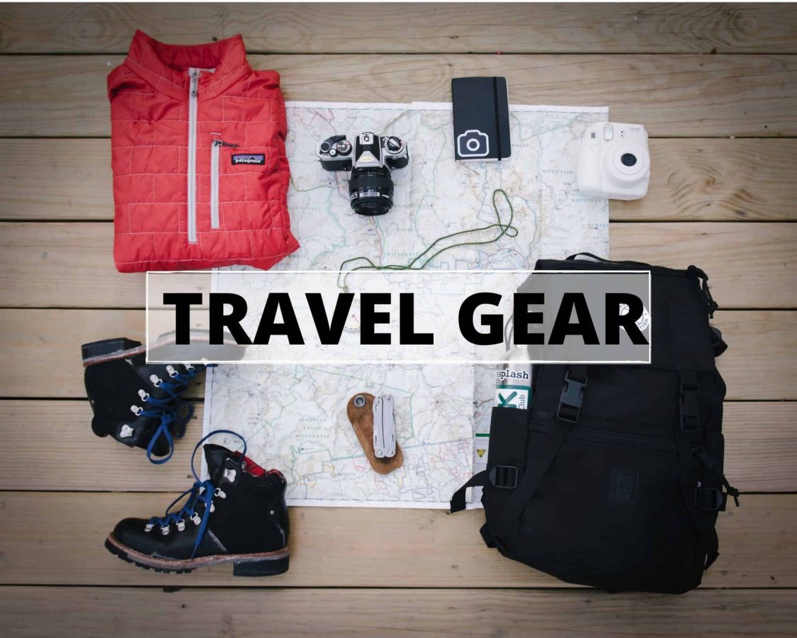 An image of a map with essential travel items and text that reads travel gear
