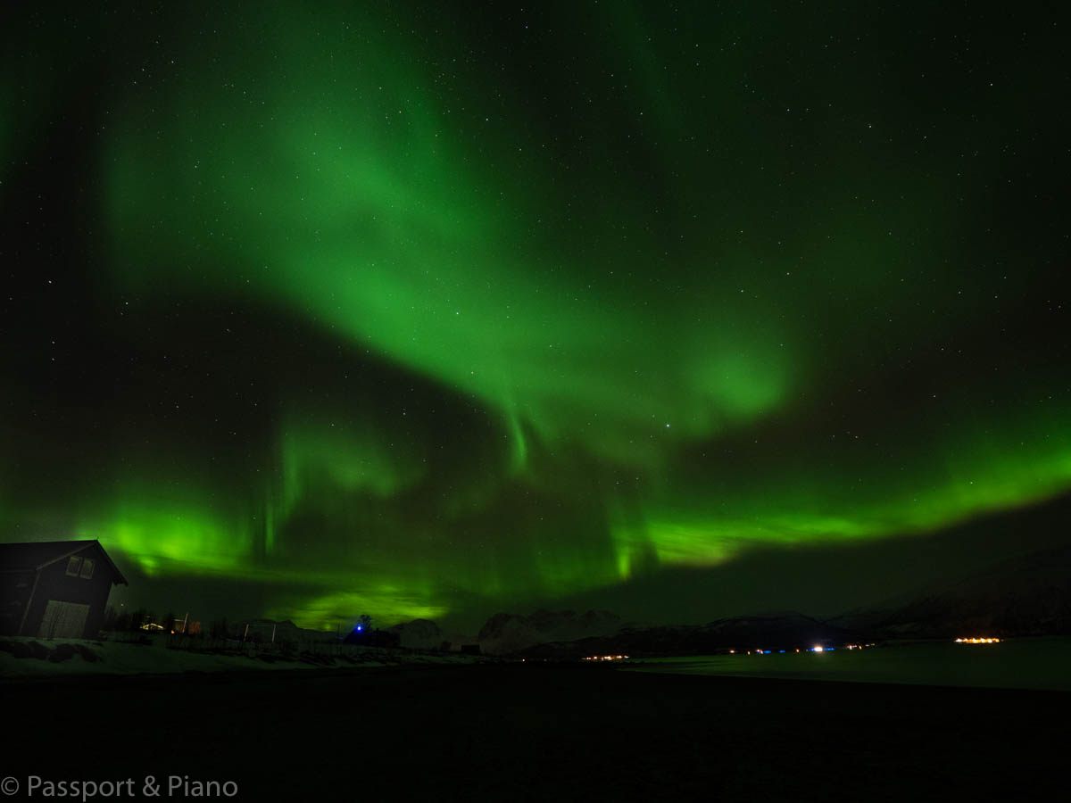 An image of an amazing aurora that filled the sky on a beach near Tønsvik, Norway